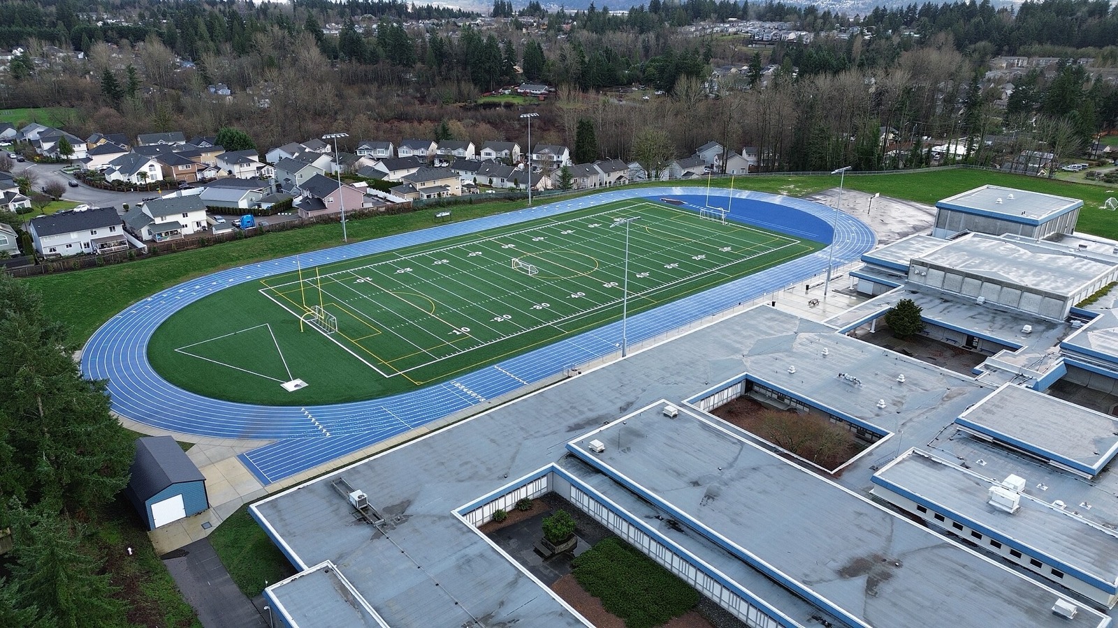 An empty football field and running track seen from above